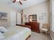Bedroom with a wooden sleigh bed, dresser, and a chair at 3000 Nw 79Th Avenue Rd, Ocala, FL 34482