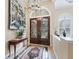 Grand entryway with double doors and decorative wall art at 3000 Nw 79Th Avenue Rd, Ocala, FL 34482