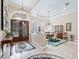 Bright and spacious entryway with decorative chandelier at 3000 Nw 79Th Avenue Rd, Ocala, FL 34482