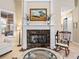 Elegant fireplace with marble surround in a cozy sitting area at 3000 Nw 79Th Avenue Rd, Ocala, FL 34482