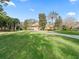 Landscaped front yard with circular driveway and lush landscaping at 3000 Nw 79Th Avenue Rd, Ocala, FL 34482
