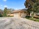 Three-car garage with paver driveway at 3000 Nw 79Th Avenue Rd, Ocala, FL 34482
