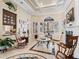 Relaxing Gathering room featuring a fireplace and views to the backyard at 3000 Nw 79Th Avenue Rd, Ocala, FL 34482