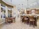 Island kitchen with breakfast bar and view into the Gathering room at 3000 Nw 79Th Avenue Rd, Ocala, FL 34482