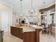 Spacious kitchen island with granite countertops and breakfast bar at 3000 Nw 79Th Avenue Rd, Ocala, FL 34482