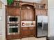 Well-equipped kitchen with ample cabinetry and stainless steel appliances at 3000 Nw 79Th Avenue Rd, Ocala, FL 34482