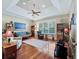 Bright living room with hardwood floors, built-in shelving, and comfortable seating at 3000 Nw 79Th Avenue Rd, Ocala, FL 34482