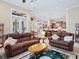 Open living room with comfortable seating and view of kitchen at 3000 Nw 79Th Avenue Rd, Ocala, FL 34482