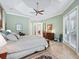 Serene main bedroom with tray ceiling and private access to patio at 3000 Nw 79Th Avenue Rd, Ocala, FL 34482