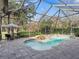 Inviting screened pool and spa with waterfall feature at 3000 Nw 79Th Avenue Rd, Ocala, FL 34482