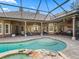 Resort-style pool and spa with covered patio and outdoor kitchen at 3000 Nw 79Th Avenue Rd, Ocala, FL 34482