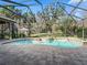 Relaxing pool and spa with screened enclosure and lush landscaping at 3000 Nw 79Th Avenue Rd, Ocala, FL 34482
