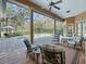 Relaxing screened-in pool area with patio furniture at 3000 Nw 79Th Avenue Rd, Ocala, FL 34482