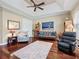 Relaxing sitting area with hardwood floors and comfy seating at 3000 Nw 79Th Avenue Rd, Ocala, FL 34482