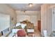 Upstairs bedroom with window and ceiling fan at 6121 County Road 547 N, Davenport, FL 33837