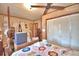 Bedroom with four-poster bed, dresser, and built-in closet at 6121 County Road 547 N, Davenport, FL 33837