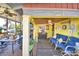 Covered porch with seating, dining area, and ceiling fan at 6121 County Road 547 N, Davenport, FL 33837