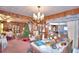 Dining room with wood paneling, table, and Christmas tree at 6121 County Road 547 N, Davenport, FL 33837