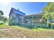 Two-story house with screened porch, deck and mature landscaping at 6121 County Road 547 N, Davenport, FL 33837