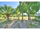 Landscaped front yard with mature trees at 6121 County Road 547 N, Davenport, FL 33837