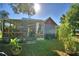 House exterior showcasing a large covered patio and yard at 6121 County Road 547 N, Davenport, FL 33837