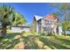 Two-story house with mature landscaping at 6121 County Road 547 N, Davenport, FL 33837