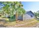Gray house exterior with palm trees at 6121 County Road 547 N, Davenport, FL 33837