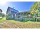 Two story house exterior with a large front porch at 6121 County Road 547 N, Davenport, FL 33837