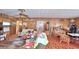 Living room with wood paneling and various furniture at 6121 County Road 547 N, Davenport, FL 33837