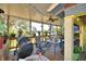 Spacious screened porch with outdoor dining and grilling area at 6121 County Road 547 N, Davenport, FL 33837