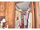 Storage area with shelves and hanging clothes at 6121 County Road 547 N, Davenport, FL 33837