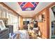Sunroom with wood paneling and seating at 6121 County Road 547 N, Davenport, FL 33837