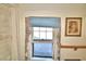 Window with light blue blinds and curtains at 6121 County Road 547 N, Davenport, FL 33837