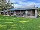 Ranch home with large porch and metal roof at 4880 Bannon Island Rd, Haines City, FL 33844
