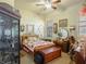 Cozy bedroom with a quilt bedspread and antique wooden furniture at 4880 Bannon Island Rd, Haines City, FL 33844