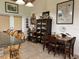 Kitchen with granite countertop, wooden table and chairs, and antique cabinets at 4880 Bannon Island Rd, Haines City, FL 33844