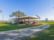 Spacious covered equipment storage area with ample room for tractors and other equipment at 4880 Bannon Island Rd, Haines City, FL 33844