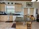 Spacious kitchen with granite island and wooden cabinets at 4880 Bannon Island Rd, Haines City, FL 33844