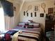 King-size bed in a bedroom with tennis decor at 323 Dorsett Ave, Lake Wales, FL 33853