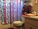 Pink bathroom with shower, toilet, and vanity at 323 Dorsett Ave, Lake Wales, FL 33853