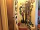 Home hallway with decorative accents and framed photos at 323 Dorsett Ave, Lake Wales, FL 33853