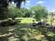 Backyard with grassy area and gardening tools at 323 Dorsett Ave, Lake Wales, FL 33853
