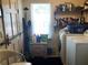 Laundry room with washer, dryer, and storage shelves at 323 Dorsett Ave, Lake Wales, FL 33853