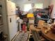 Kitchen with cluttered dining area and appliances at 323 Dorsett Ave, Lake Wales, FL 33853