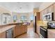 Kitchen features stainless steel appliances, an island, and a breakfast nook with built-in seating at 3082 Landings Ct, Haines City, FL 33844