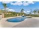 Inviting kidney-shaped pool with a spa and a surrounding patio at 3082 Landings Ct, Haines City, FL 33844