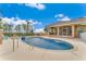 Relaxing freeform pool with a spa and screened enclosure at 3082 Landings Ct, Haines City, FL 33844