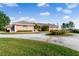 Beautiful home with circular driveway and landscaping at 3082 Landings Ct, Haines City, FL 33844