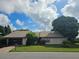 Exterior of a ranch style home with a mature tree in front at 292 Hernando Rd, Winter Haven, FL 33884