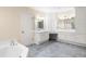 Large Primary bathroom with double vanity, shower, and ample storage at 110 Woden Way, Winter Haven, FL 33884